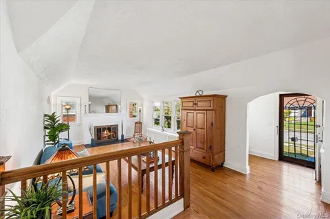 a view of an entryway with wooden floor and windows