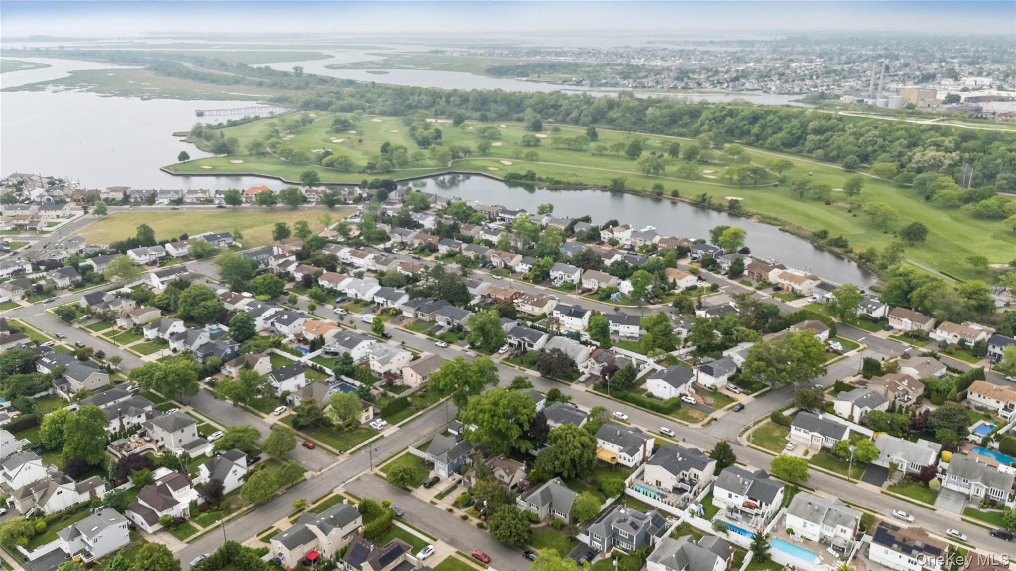 2772 Riverside Avenue Merrick, NY 11566 - Photo 40 of 45 a view of a city with a lush green forest