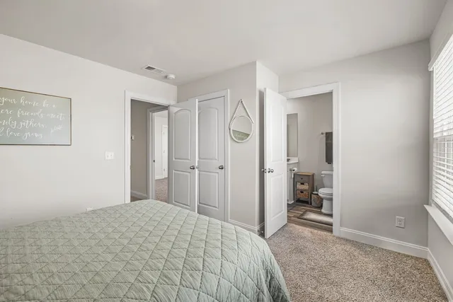 a bathroom with a sink toilet and mirror