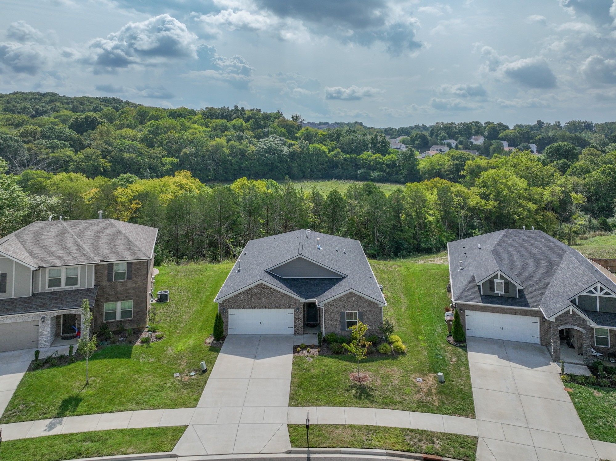 551 Fall Creek Circle Goodlettsville, TN 37072 - Photo 2 of 28 an aerial view of a house with a garden and lake view