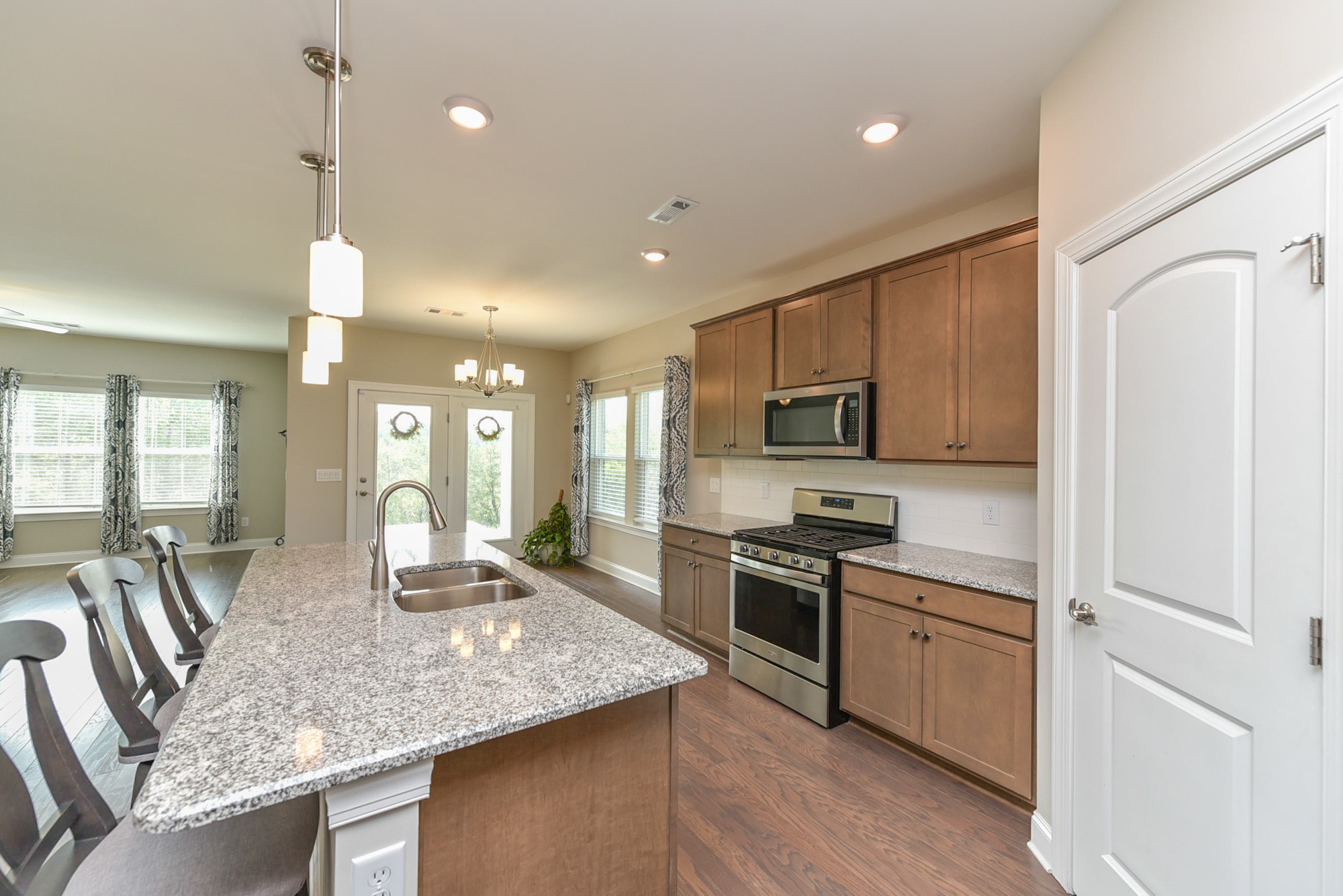551 Fall Creek Circle Goodlettsville, TN 37072 - Photo 5 of 28 a kitchen with stainless steel appliances granite countertop a sink refrigerator and cabinets