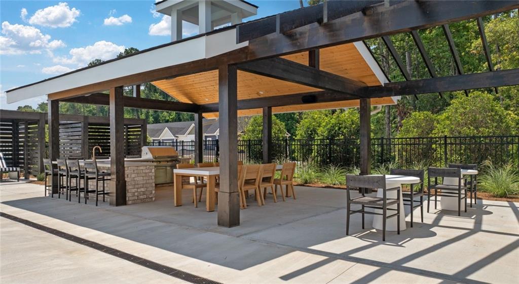 100 Rosemoore Drive Covington, GA 30014 - Photo 28 of 41 a view of a porch with chairs and backyard