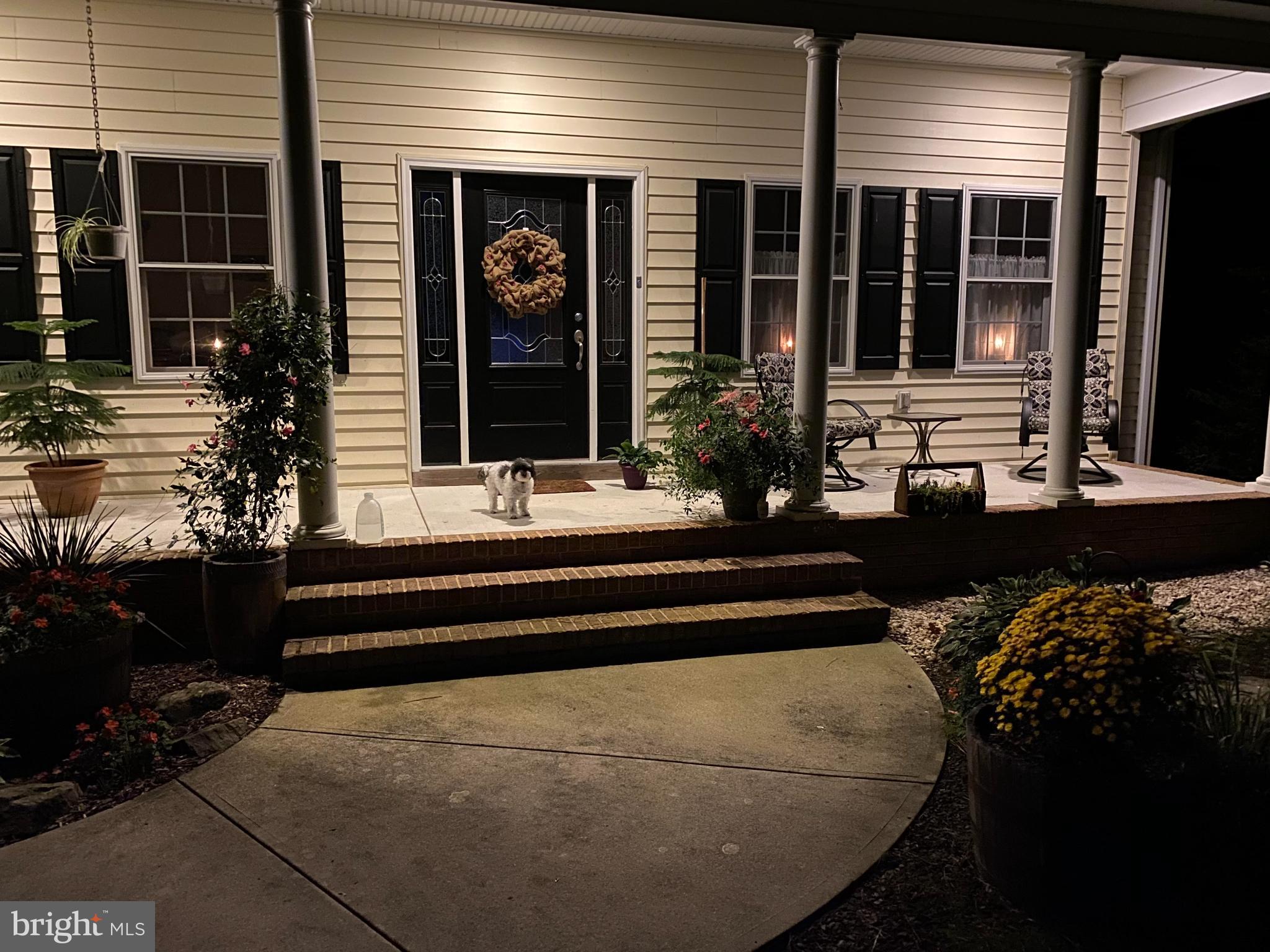 7395 Cherry Walk Road Hebron, MD 21830 - Photo 11 of 61 Charming night view of a welcoming porch.