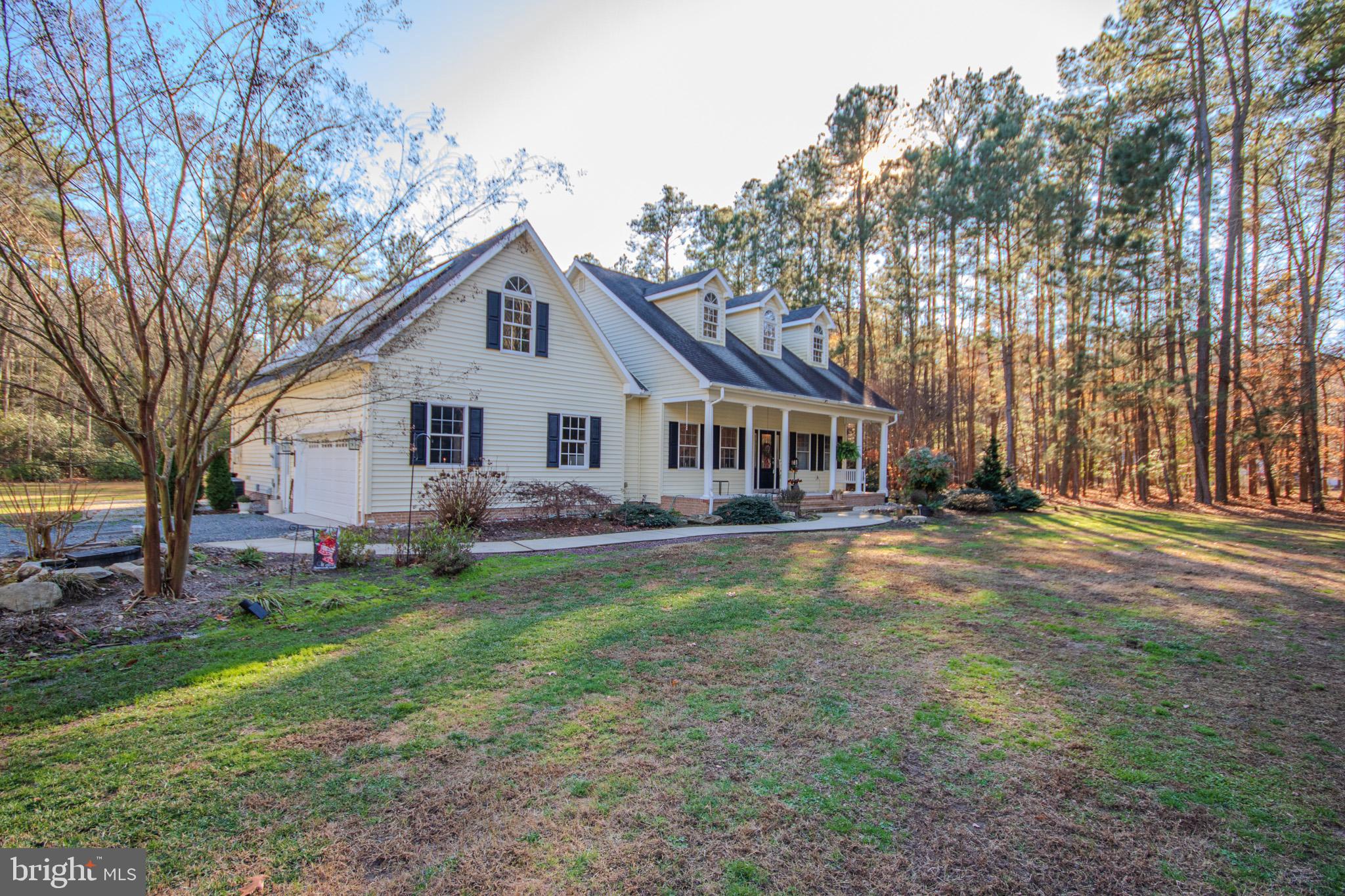7395 Cherry Walk Road Hebron, MD 21830 - Photo 12 of 61 a front view of a house with yard and tree