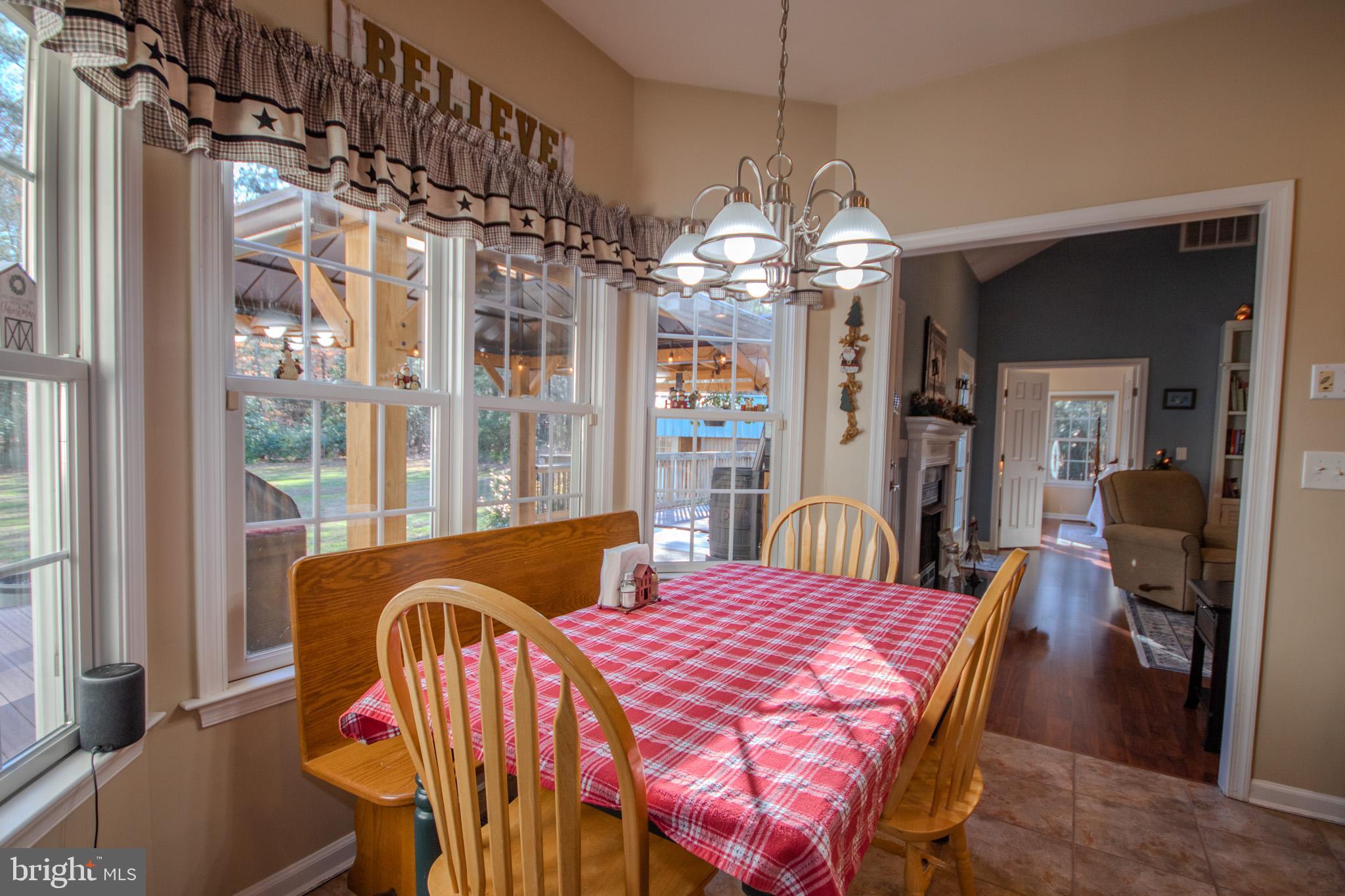 7395 Cherry Walk Road Hebron, MD 21830 - Photo 19 of 61 a view of a dining room with furniture window and wooden floor