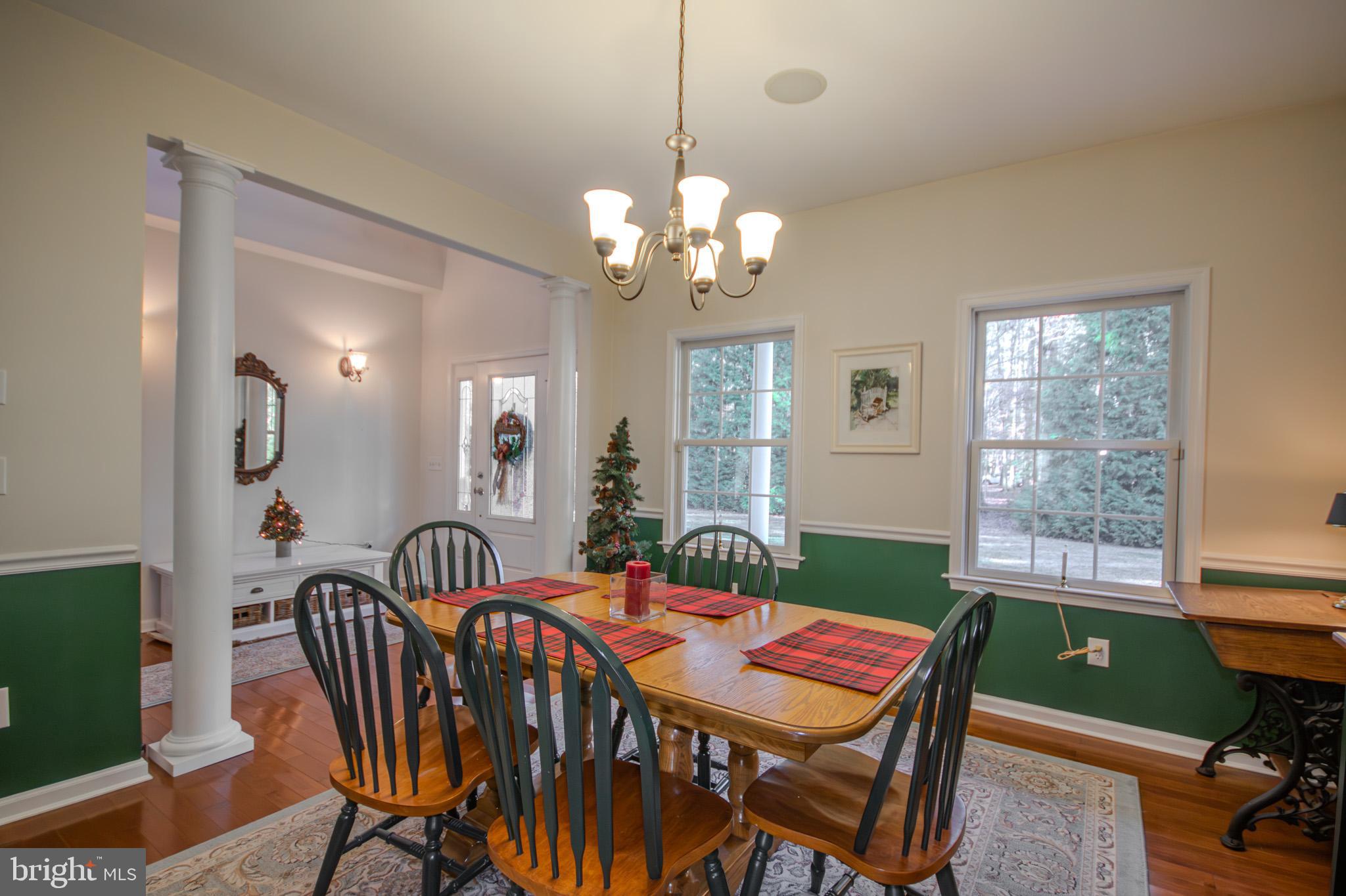 7395 Cherry Walk Road Hebron, MD 21830 - Photo 24 of 61 a dining room with furniture a chandelier and window