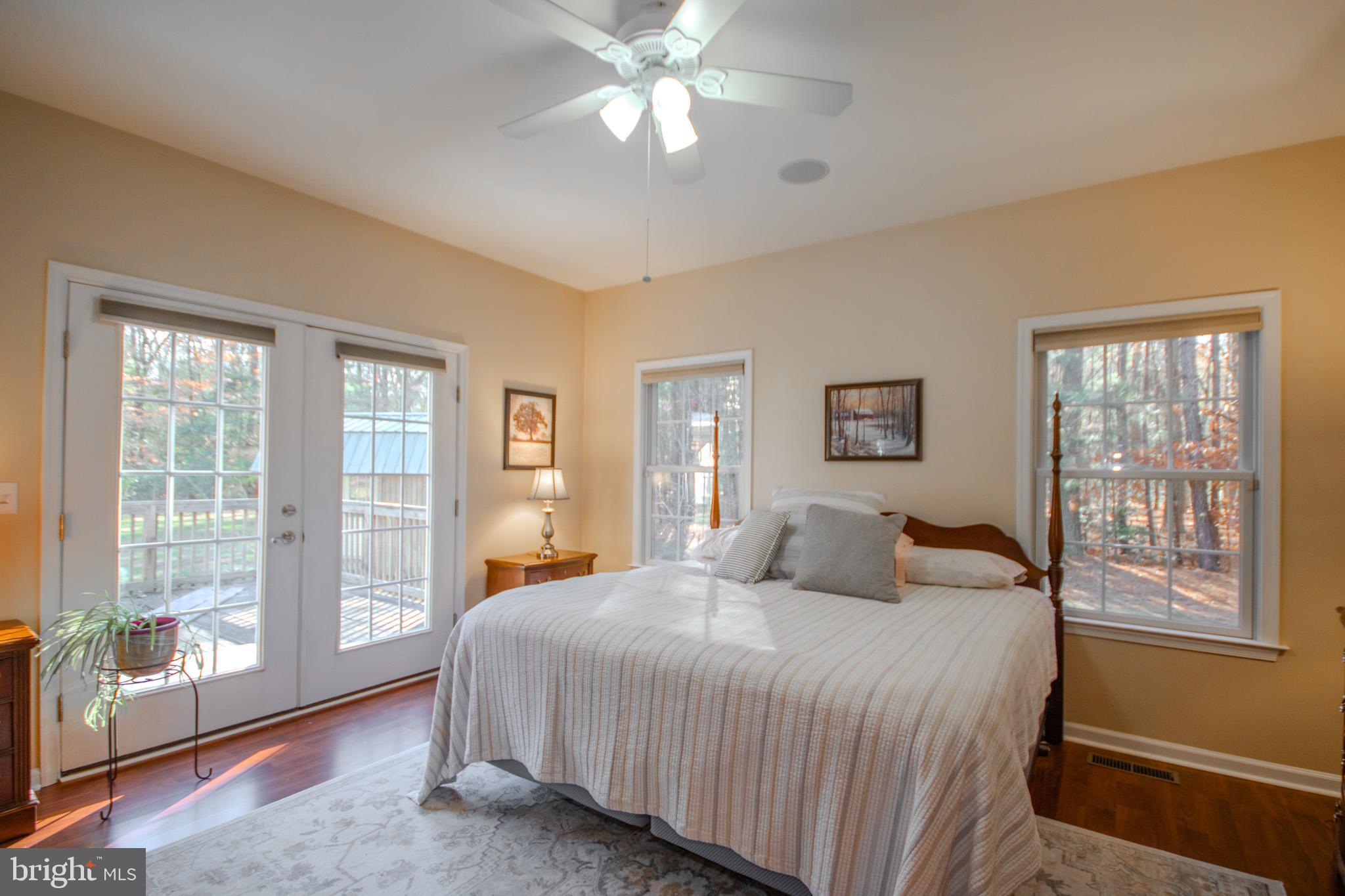 7395 Cherry Walk Road Hebron, MD 21830 - Photo 27 of 61 a bedroom with a large bed and a large window