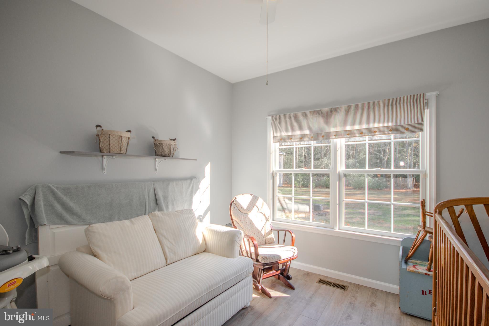 7395 Cherry Walk Road Hebron, MD 21830 - Photo 32 of 61 a living room with furniture and a window