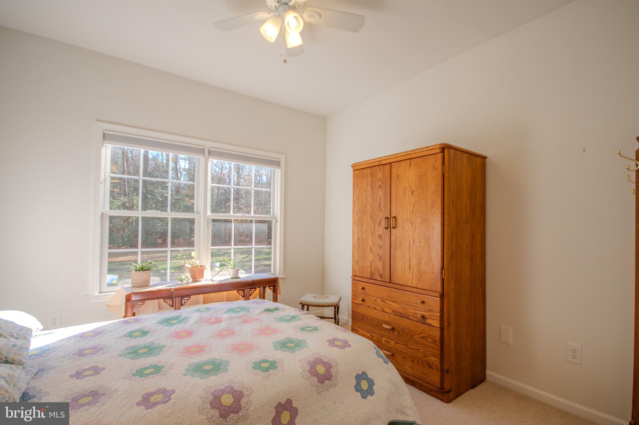 7395 Cherry Walk Road Hebron, MD 21830 - Photo 35 of 61 a bedroom with a bed and a large window