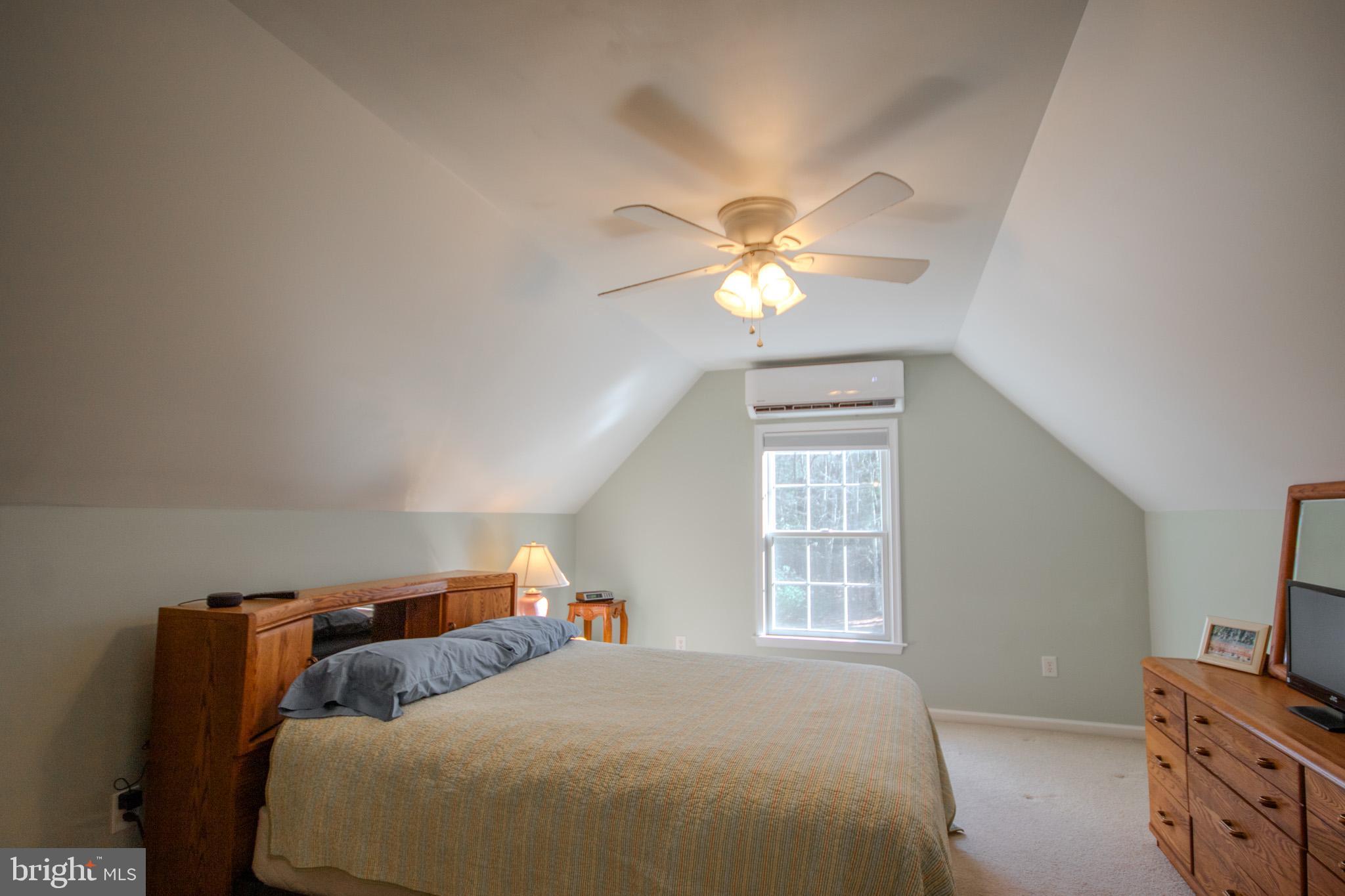 7395 Cherry Walk Road Hebron, MD 21830 - Photo 40 of 61 a bedroom with a bed and a chandelier