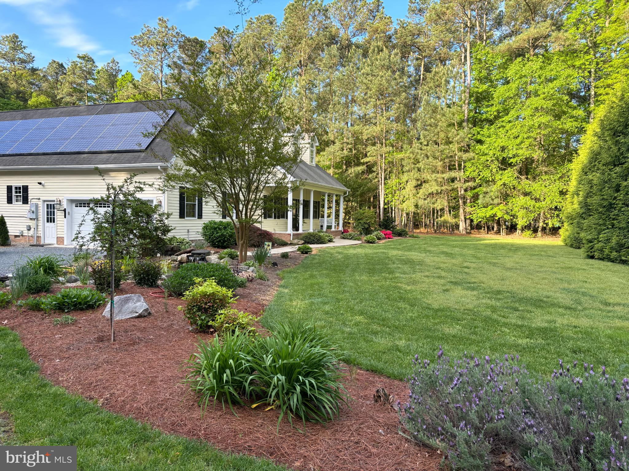 7395 Cherry Walk Road Hebron, MD 21830 - Photo 4 of 61 a front view of a house with a yard
