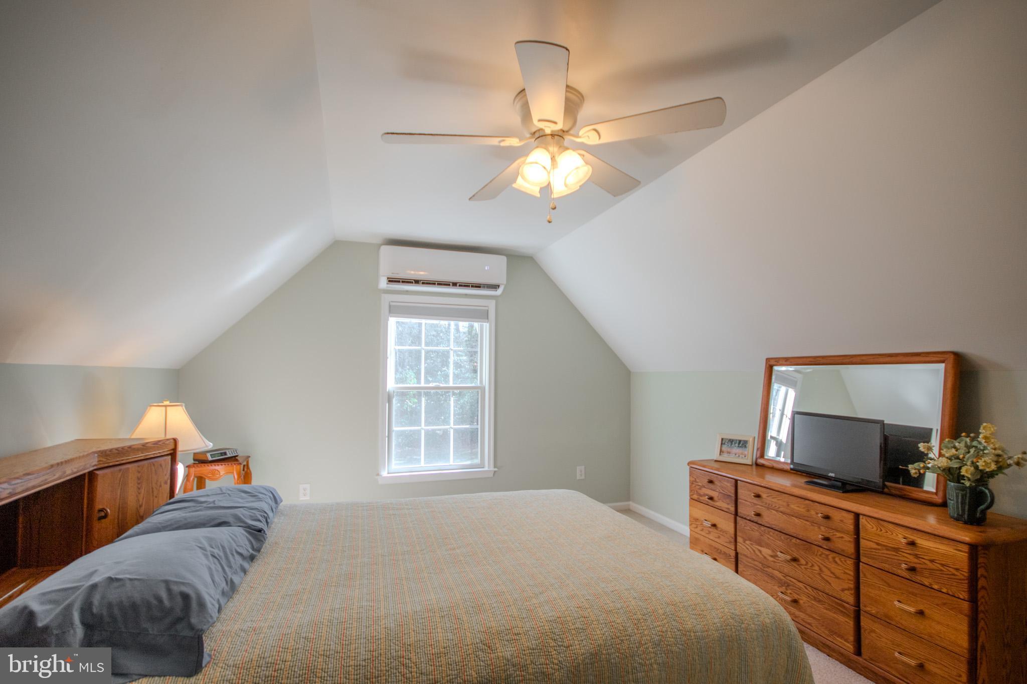 7395 Cherry Walk Road Hebron, MD 21830 - Photo 41 of 61 a bedroom with a bed and a chandelier