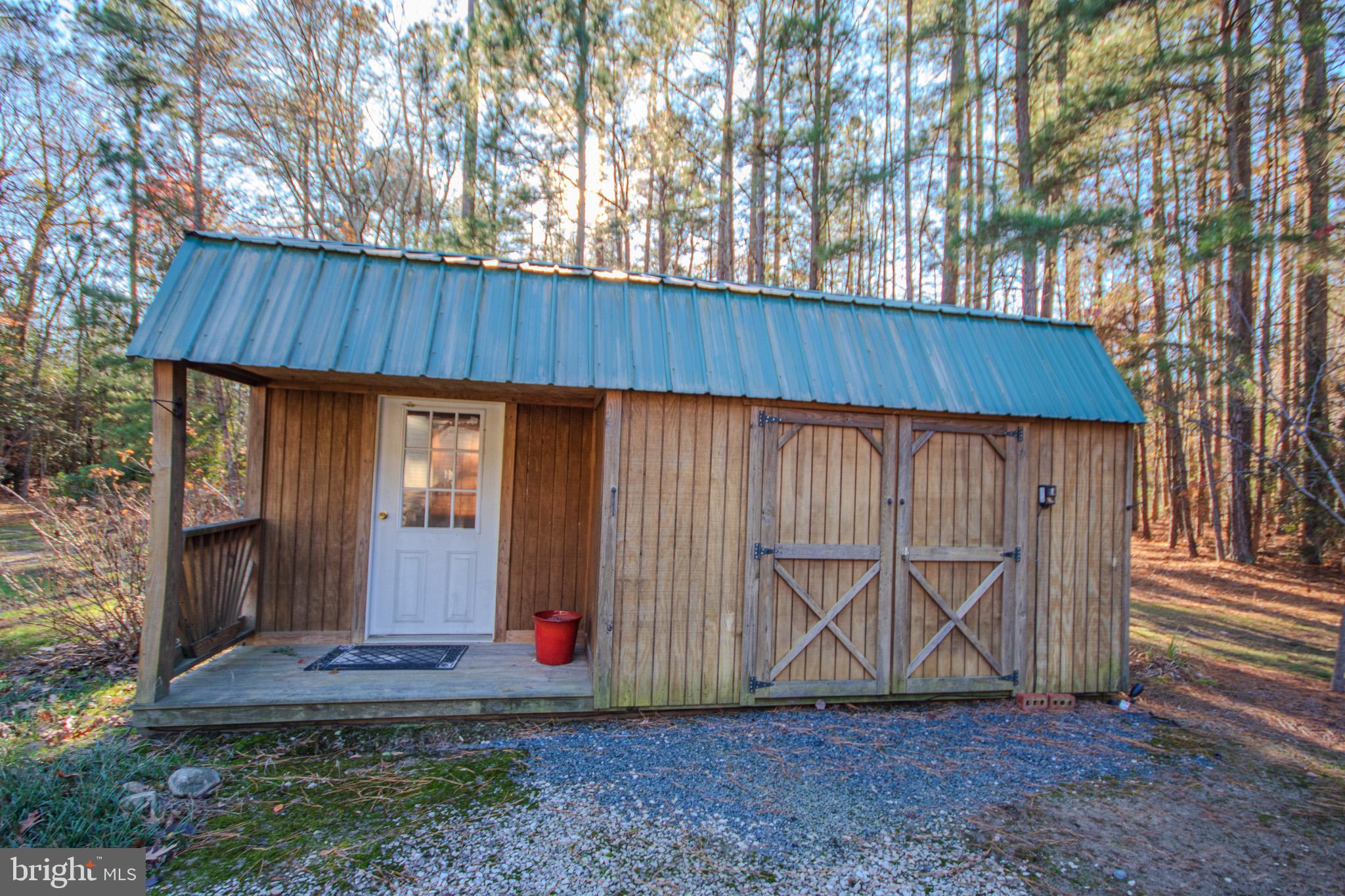7395 Cherry Walk Road Hebron, MD 21830 - Photo 56 of 61 Charming cabin nestled among tall pines.