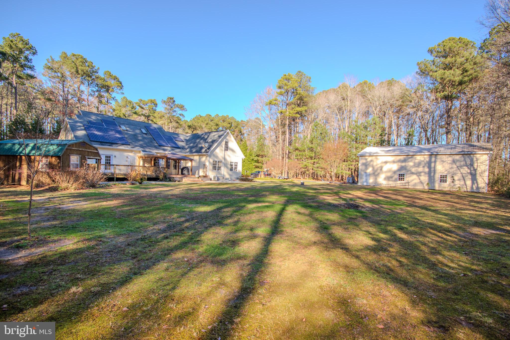 7395 Cherry Walk Road Hebron, MD 21830 - Photo 59 of 61 a backyard of a house with lots of green space and outdoor seating