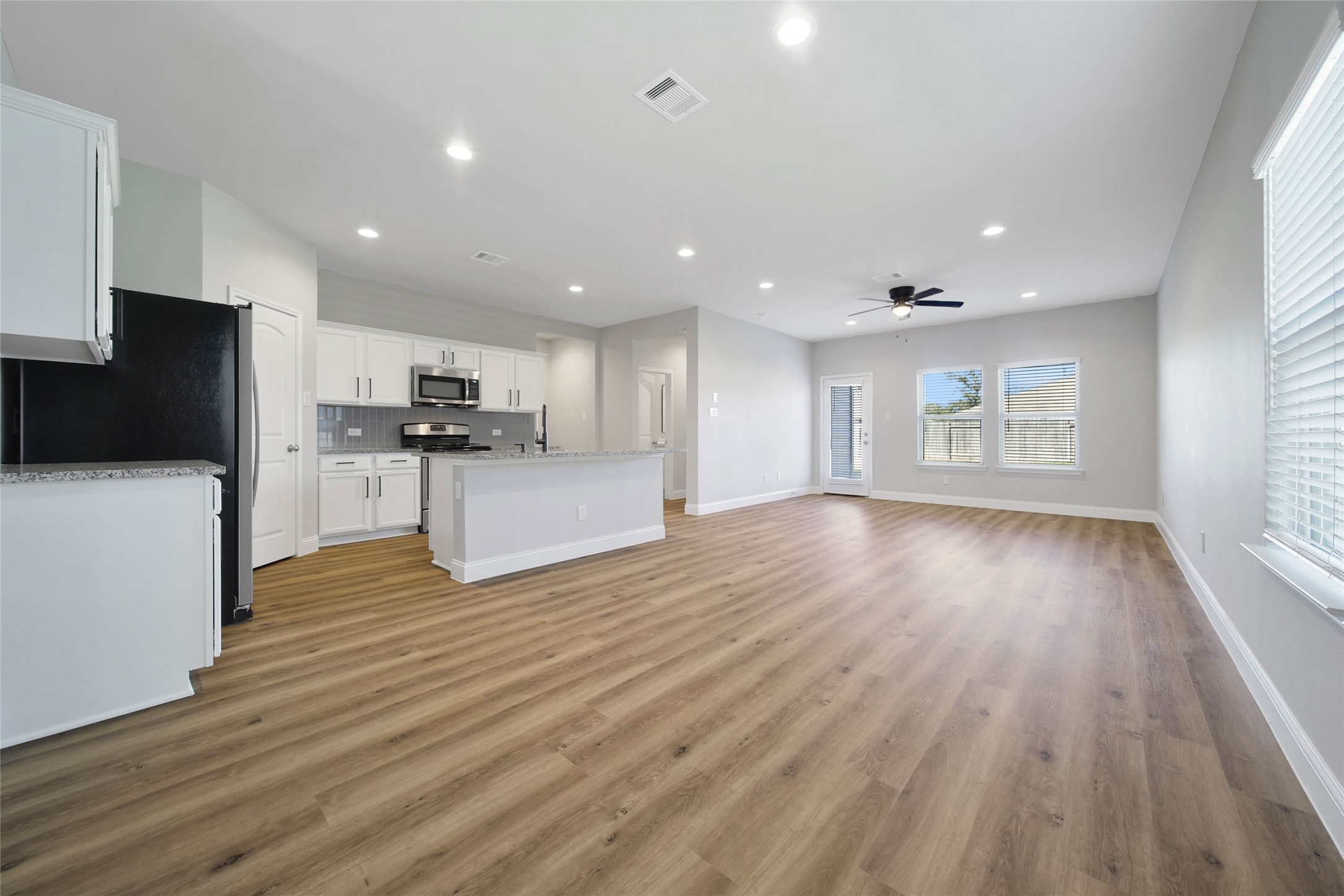 2415 Sutton Hollow Court Spring, TX 77373 - Photo 40 of 40 a view of an empty room with wooden floor and a window