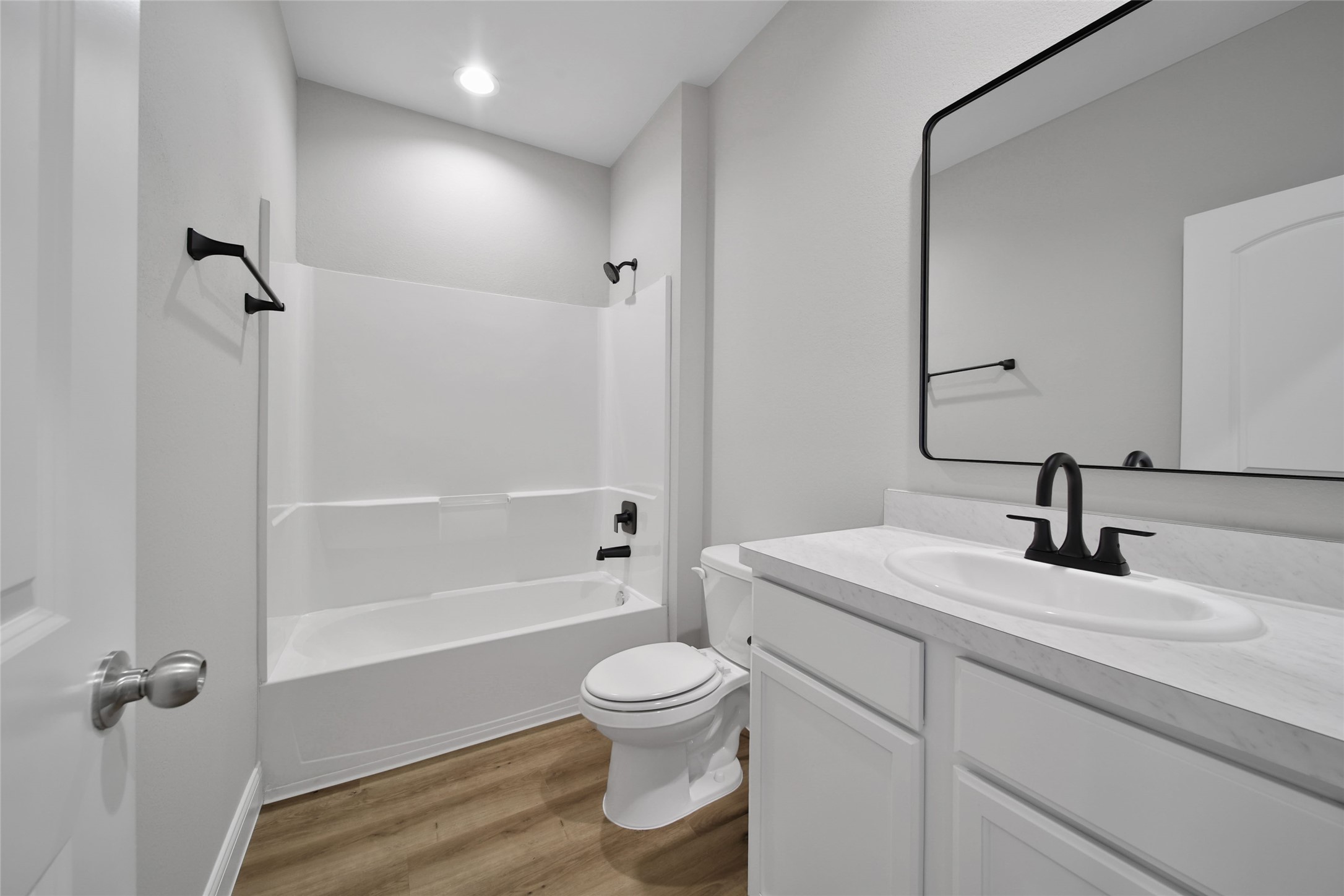 2415 Sutton Hollow Court Spring, TX 77373 - Photo 15 of 40 a bathroom with a granite countertop sink toilet a mirror and shower