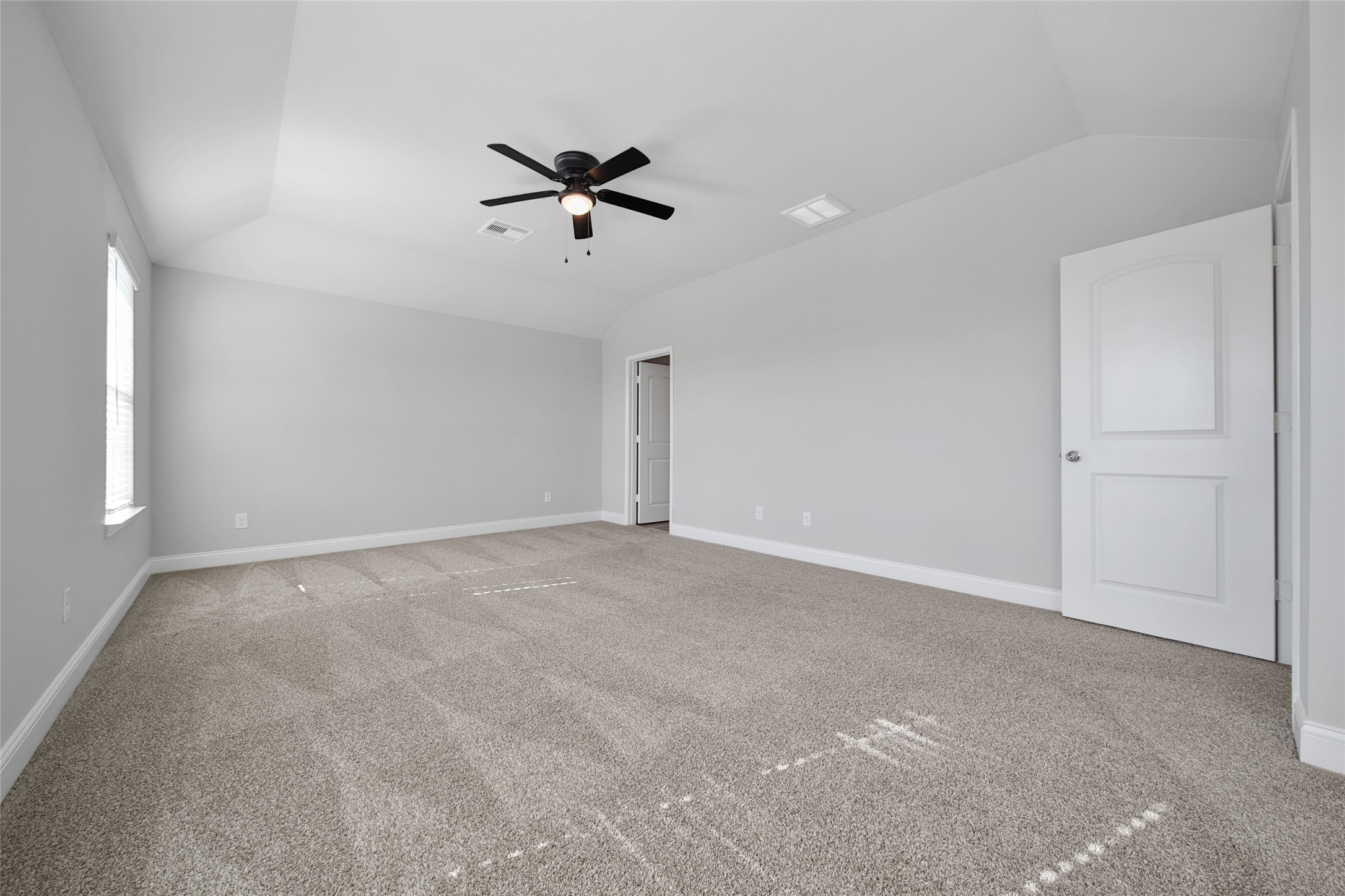 2415 Sutton Hollow Court Spring, TX 77373 - Photo 24 of 40 a view of a big room with a ceiling fan and entryway