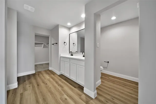 a view of a big room with a ceiling fan and entryway