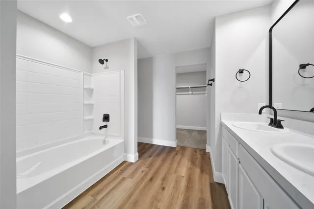 a bathroom with a sink and mirror