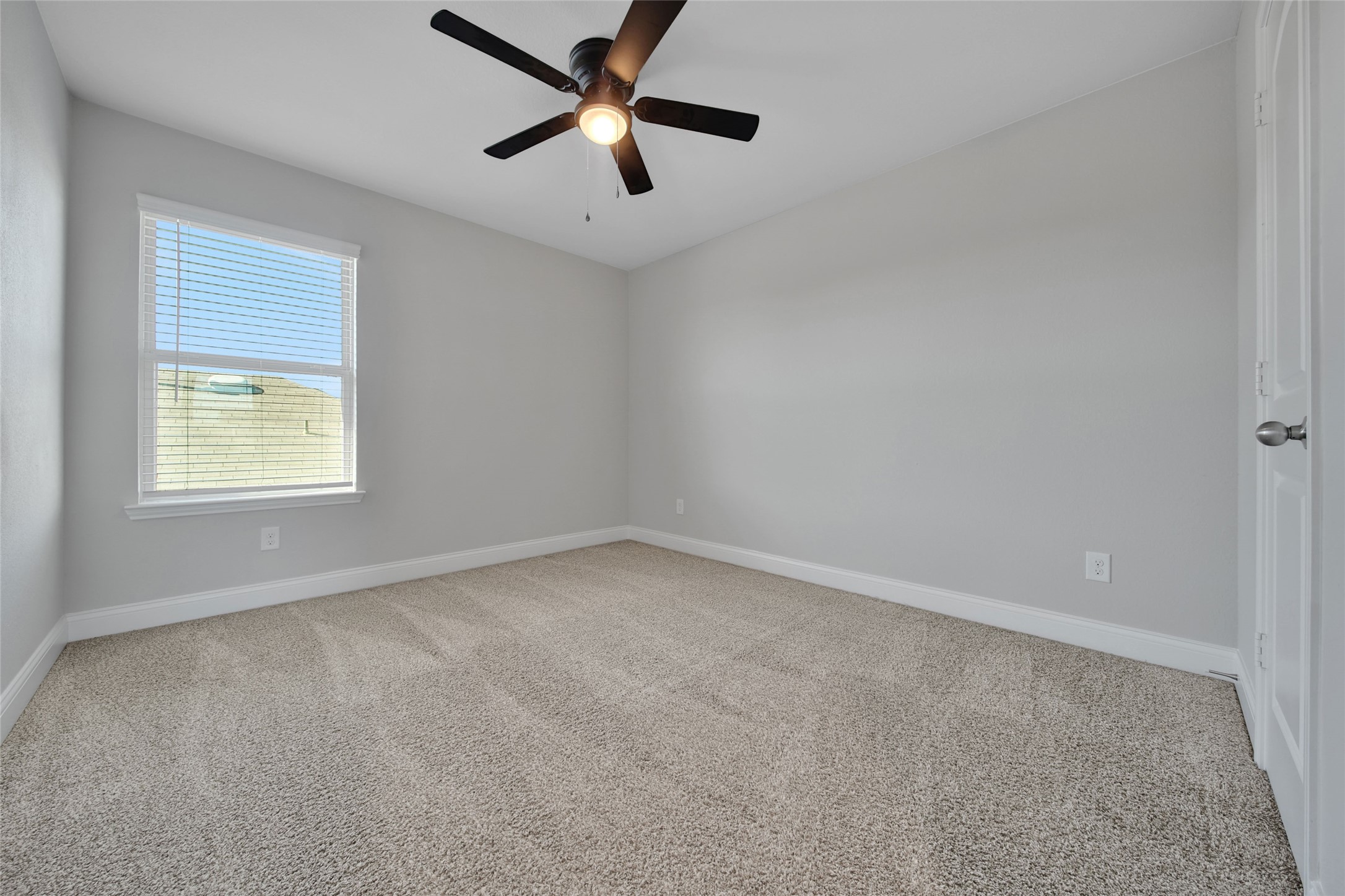 2415 Sutton Hollow Court Spring, TX 77373 - Photo 32 of 40 an empty room with a window and a fan