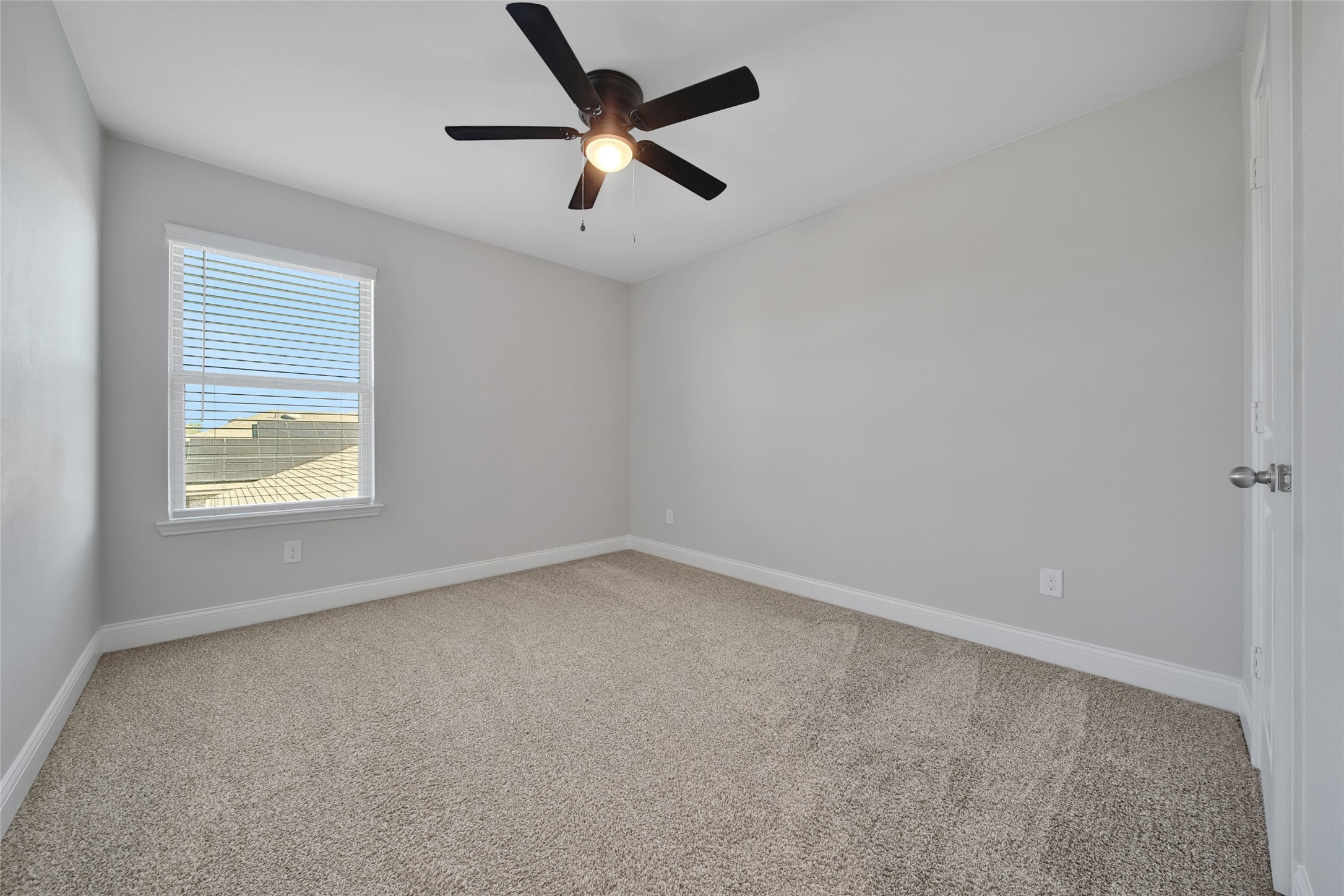 2415 Sutton Hollow Court Spring, TX 77373 - Photo 34 of 40 an empty room with a window and a fan