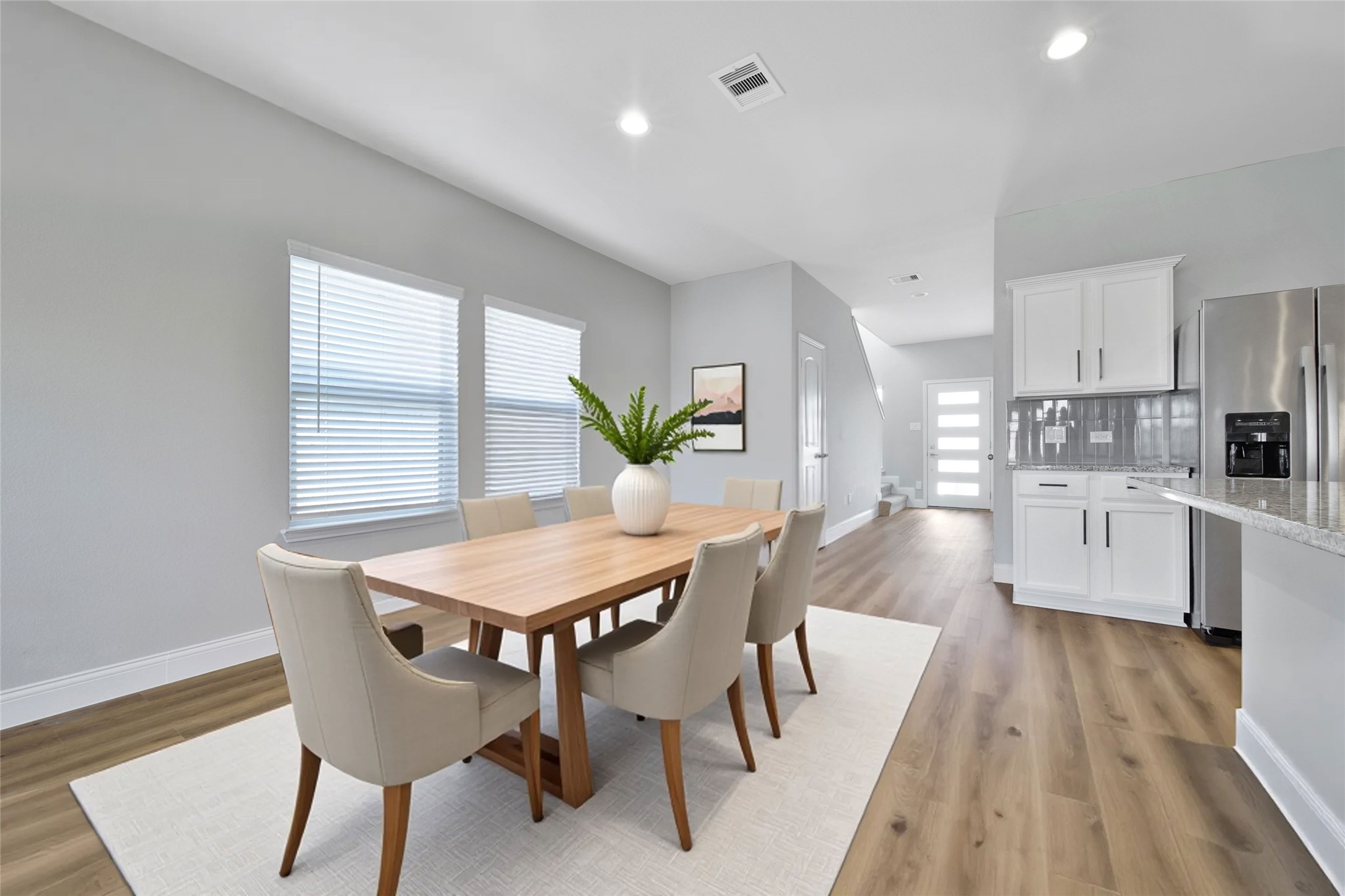 2415 Sutton Hollow Court Spring, TX 77373 - Photo 6 of 40 a view of a dining room with furniture and wooden floor