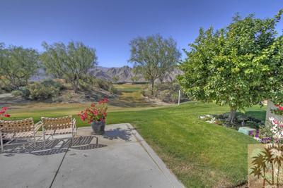 56565 Riviera La Quinta, CA 92253 - Photo 15 of 25 a view of a garden with a lake