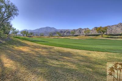 56565 Riviera La Quinta, CA 92253 - Photo 16 of 25 a view of a grassy field with an trees