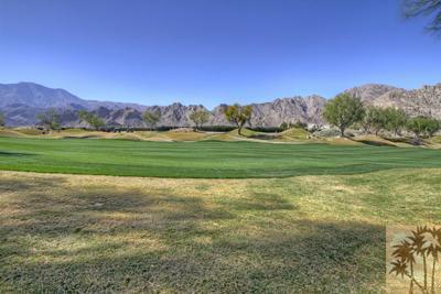 56565 Riviera La Quinta, CA 92253 - Photo 17 of 25 a view of a grassy field with mountain