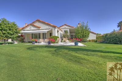 56565 Riviera La Quinta, CA 92253 - Photo 2 of 25 a front view of house with yard and green space
