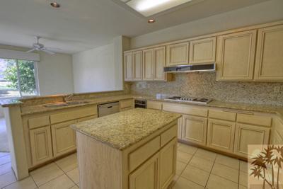 56565 Riviera La Quinta, CA 92253 - Photo 4 of 25 a kitchen with a sink cabinets and window