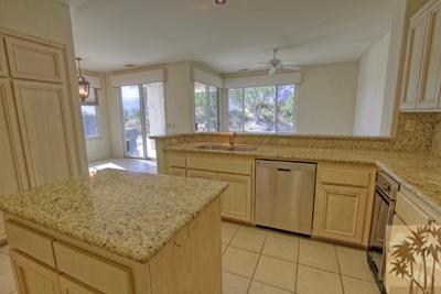 56565 Riviera La Quinta, CA 92253 - Photo 5 of 25 a kitchen with cabinets and window