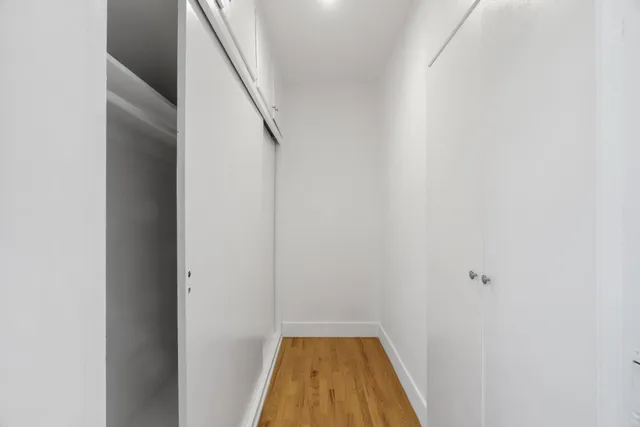 a view of a hallway with white walls