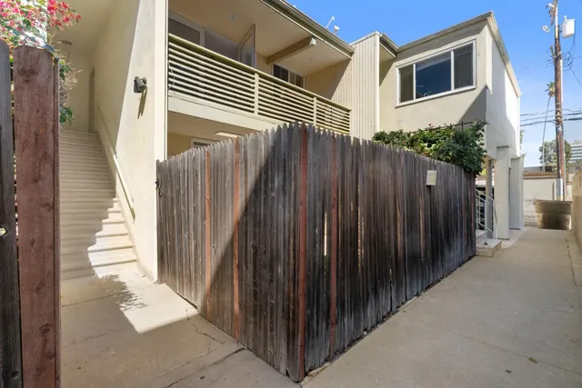 a view of a wooden door with a street