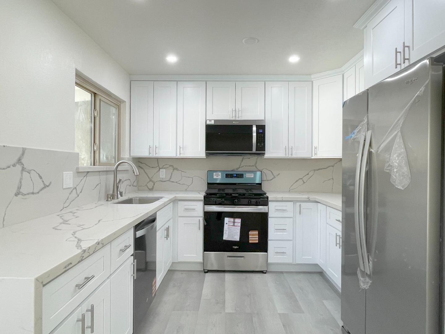 5070 Plaza Corona Santa Clara, CA 95054 - Photo 6 of 18 a kitchen with a sink stove and refrigerator