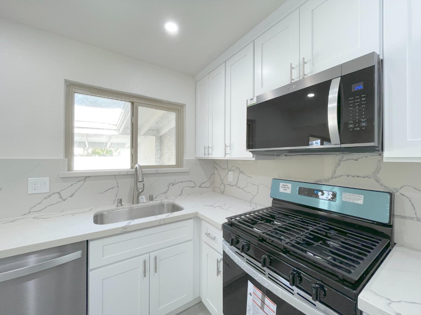 5070 Plaza Corona Santa Clara, CA 95054 - Photo 8 of 18 a kitchen with a sink a stove and cabinets