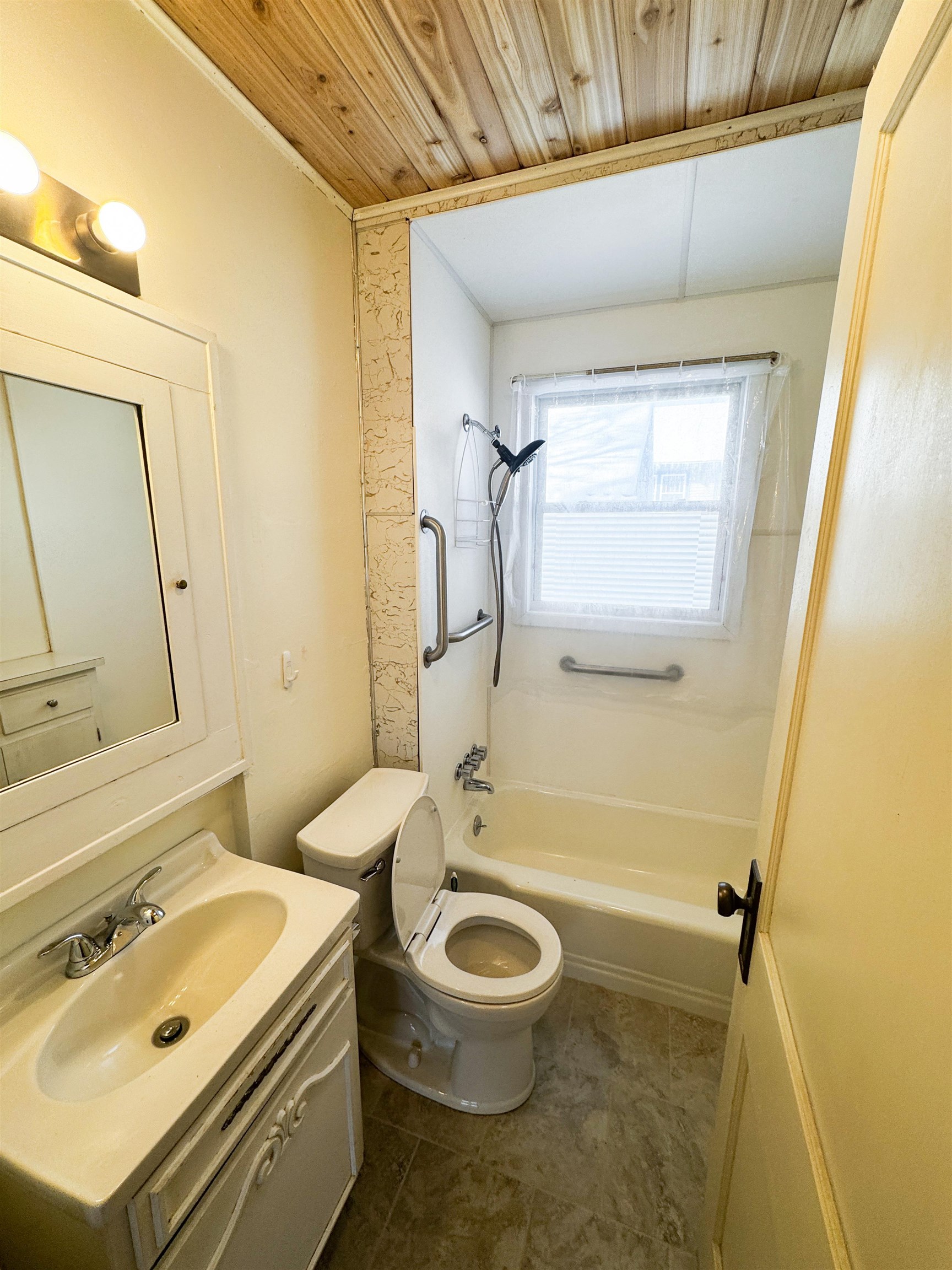 315 3rd Avenue East Washburn, WI 54891 - Photo 14 of 14 Bathroom with vanity, wooden ceiling, and bathtub / shower combination