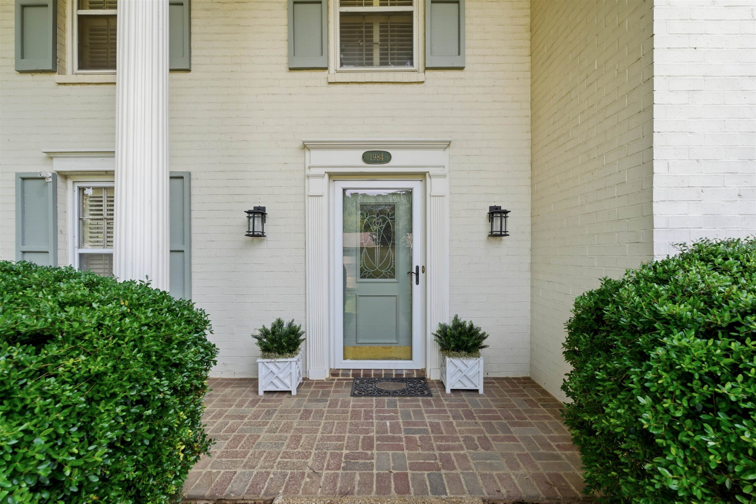 1984 Allenby Road Germantown, TN 38139 - Photo 8 of 37 Painted brick exterior with a prominent fluted column and light blue shutters