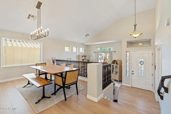 a view of a dining room with furniture window and wooden floor