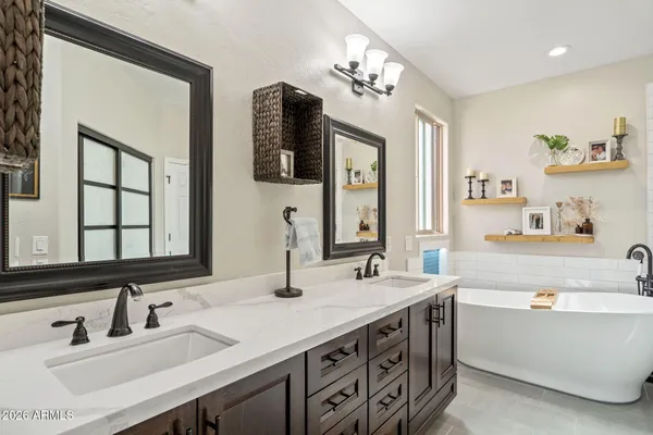 a bathroom with a bathtub and shower