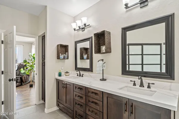 a spacious bathroom with a tub shower and sink