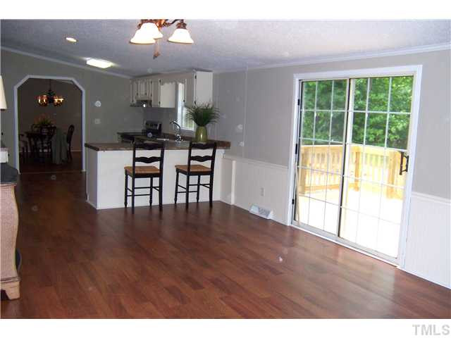 2559 Smith Road Oxford, NC 27565 - Photo 13 of 25 Glass sliders open on to back porch making family barbecues a breeze! Den/Family/Great Room