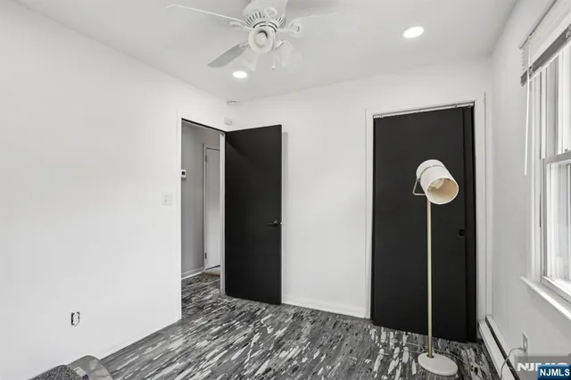 a workspace with wooden floor and a window