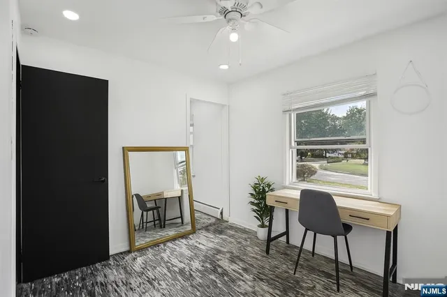 a bathroom with a sink vanity granite and toilet