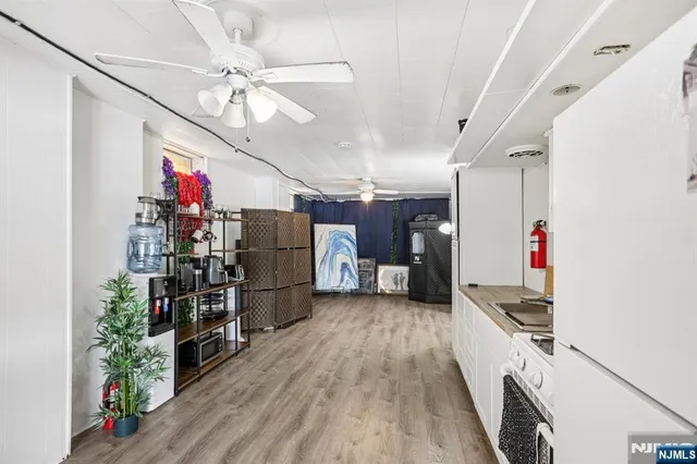a kitchen with stainless steel appliances a stove a refrigerator and a sink