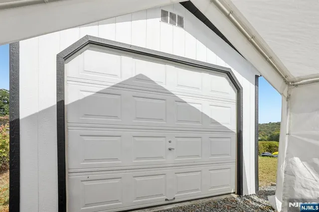 an aerial view of a house with a lake view