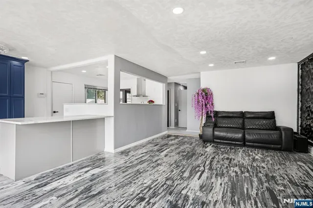 a living room with a couch and a stove