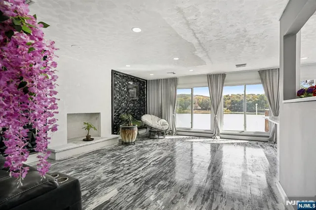 a kitchen with stainless steel appliances a sink and a large window
