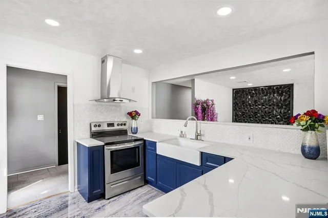 a kitchen with a refrigerator and a sink