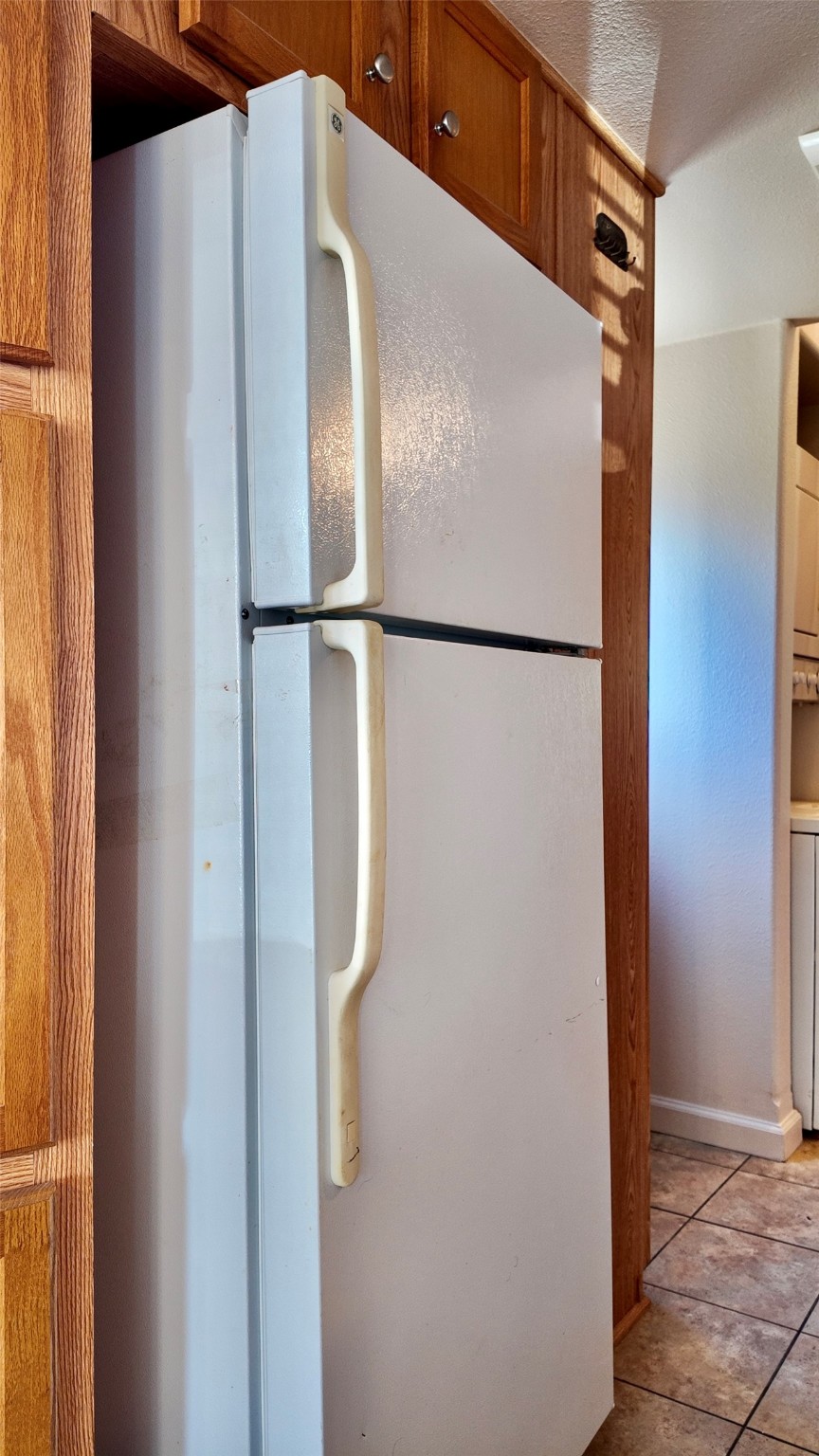 11720 Thousand Trail, Unit 13 Conroe, TX 77304 - Photo 11 of 35 a white refrigerator freezer and a microwave